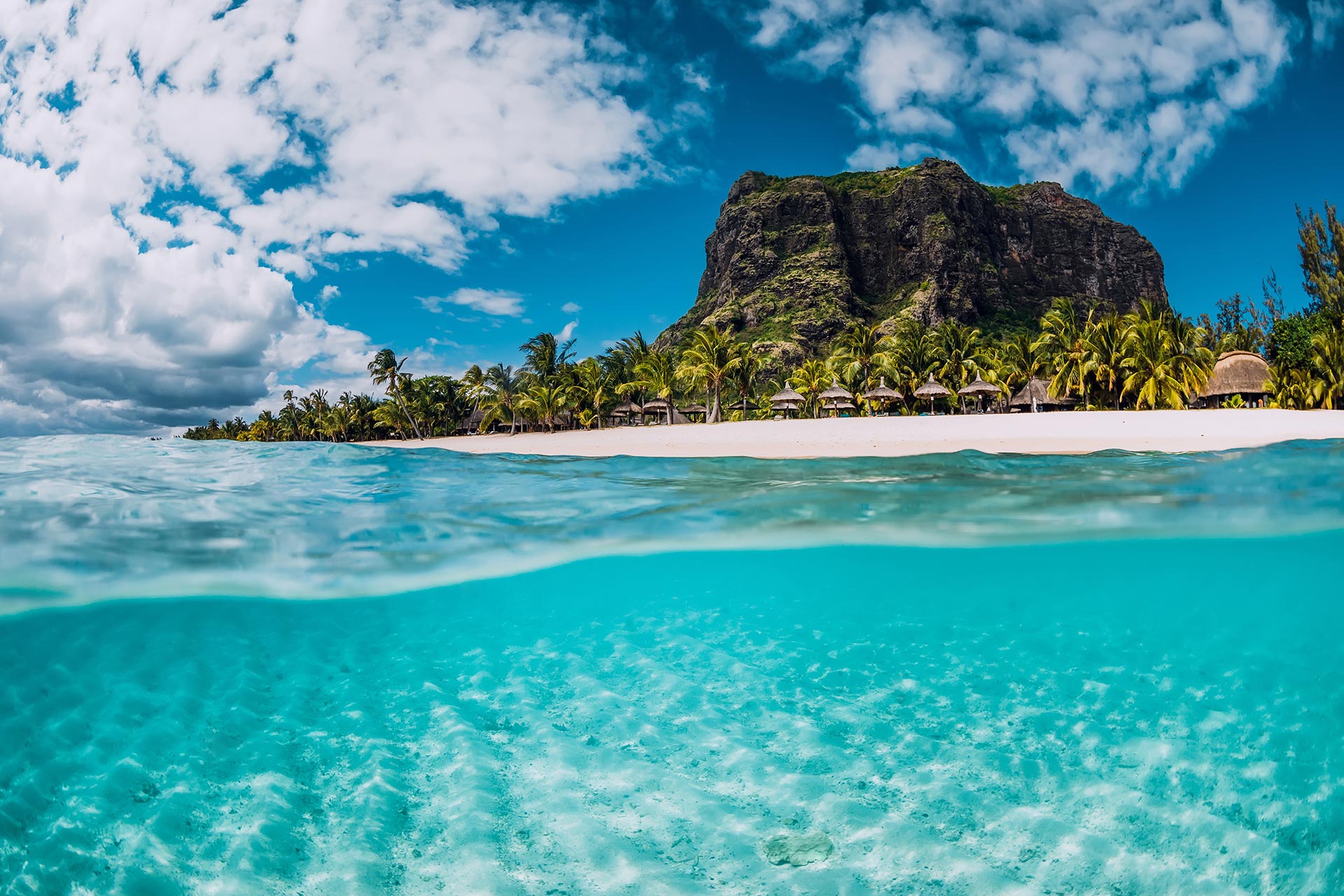 tropical-crystal-ocean-with-le-morne-mountain-and-luxury-beach-in-mauritius-split-view-adobestock290542623-1.jpg