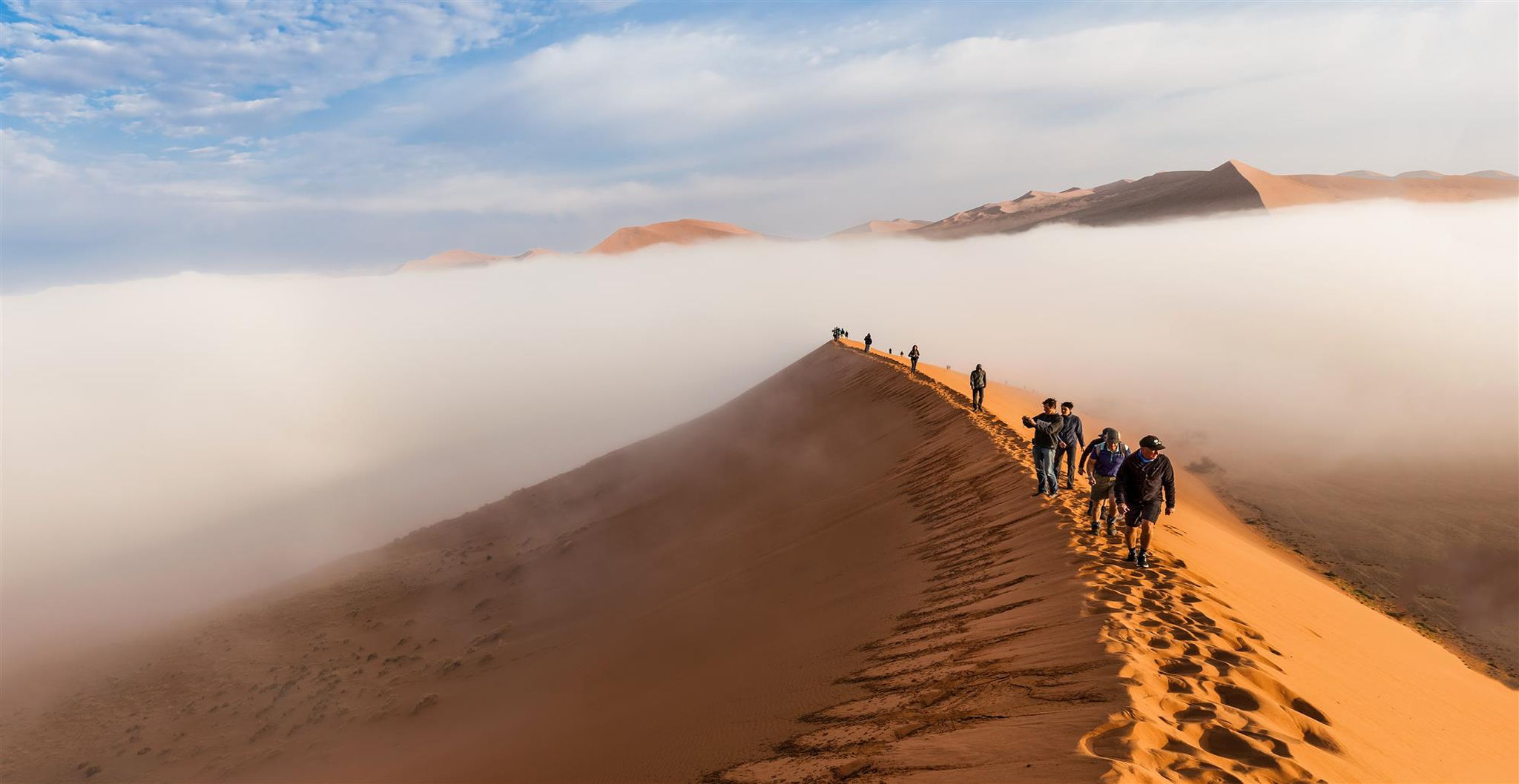 tourists-climbing-up-dune-early-morning-sossusvlei-namibia-desertjpg-2.jpg